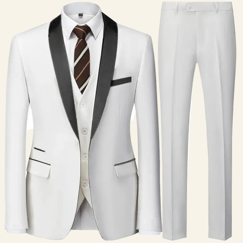 White suit with black lapels and a brown striped tie  