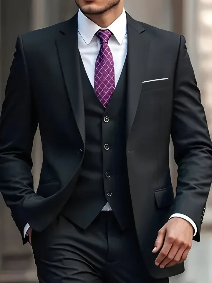 black suit with a purple tie  