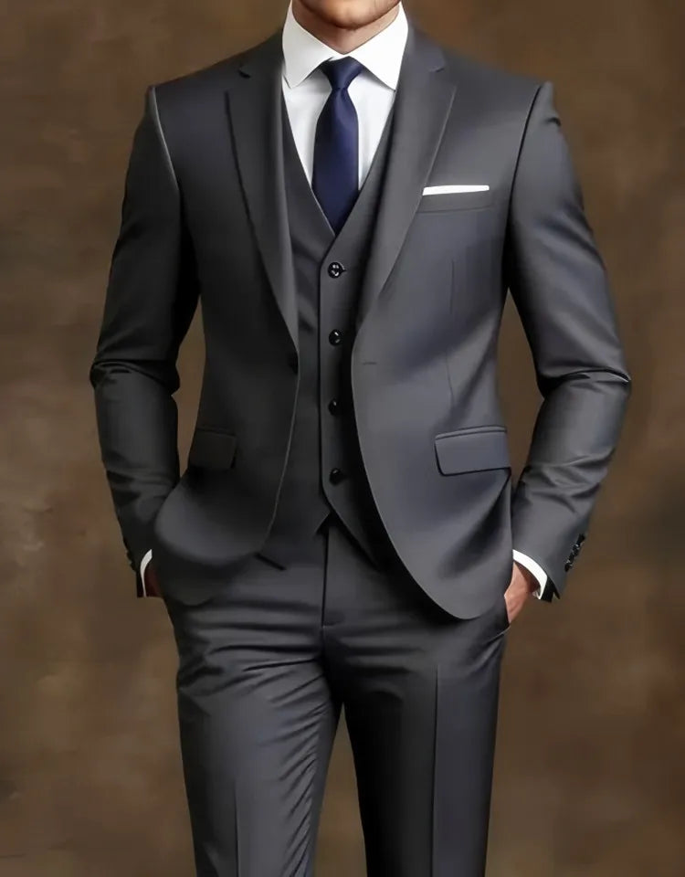 Gray suit with a white shirt and navy tie  