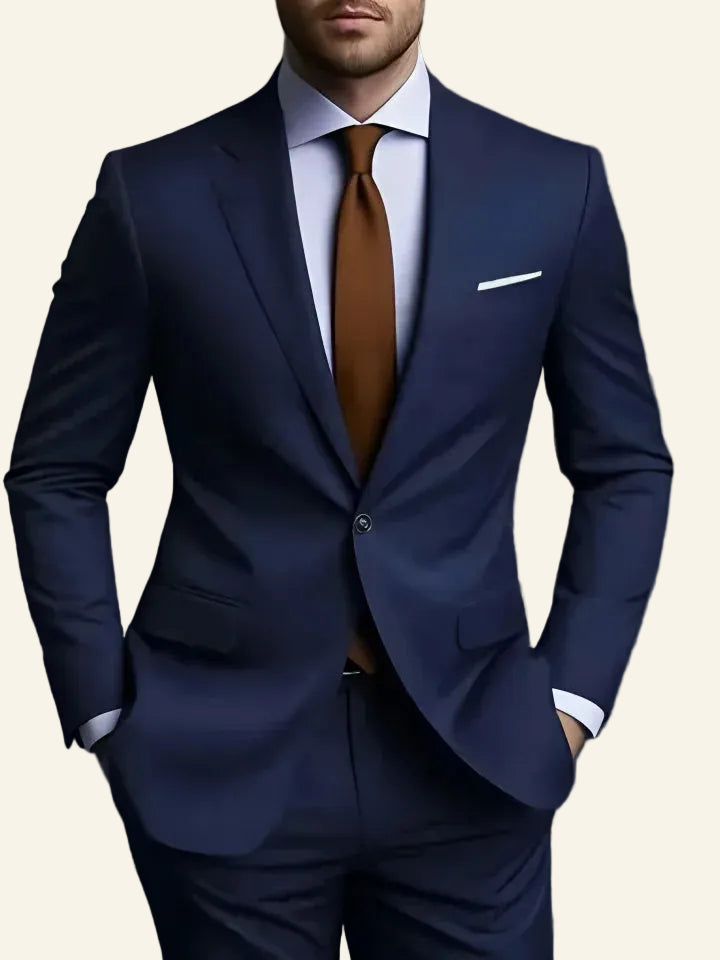 blue suit with a brown tie 